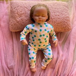 Reborn baby doll with clothing and bibs